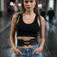 HarnessClub black vegan leather waist cincher belt with buckles and straps on a model