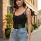 Black vegan leather waist cincher belt with metal buckles and shoulder straps