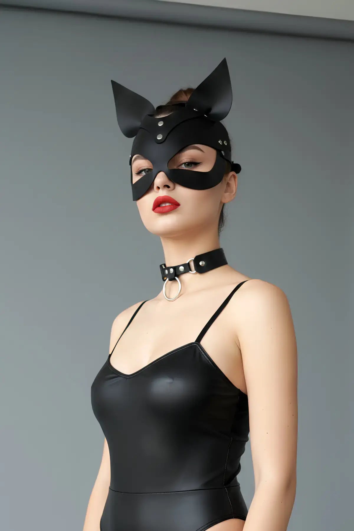 Black cat-ear vegan leather eye mask by HarnessClub; matte black with silver rivets