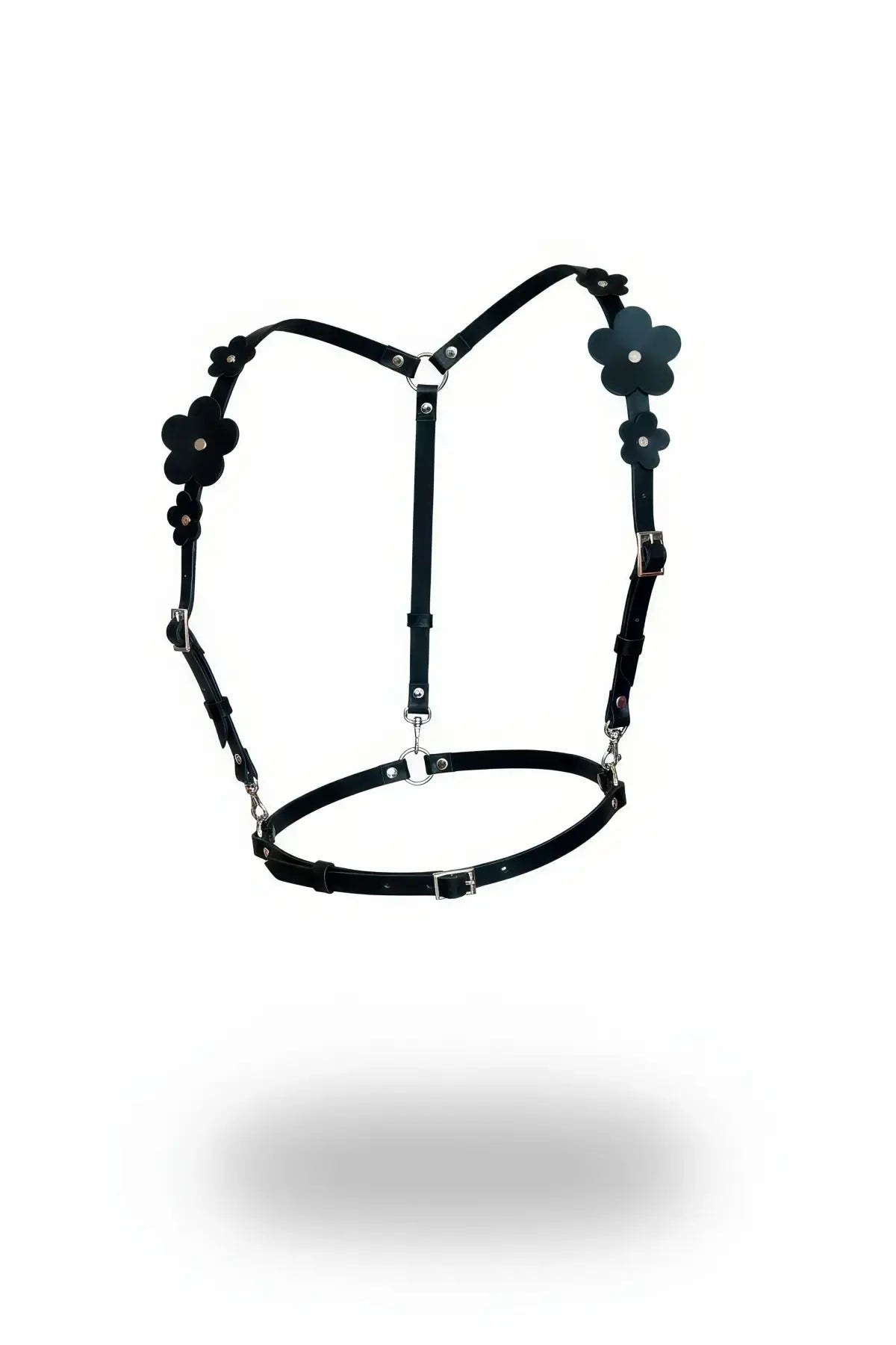 HarnessClub black vegan leather chest harness with matte flower appliques and circular waist belt.
