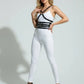 HarnessClub black vegan-leather chest-and-waist multi-band body harness worn by model over white outfit.
