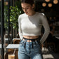 Over-Skirt Fringe Waist Belt by HarnessClub in black faux leather with chain-drops, worn over denim.