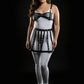 Plus-size black vegan-leather belted caged bralette and skirt harness set.