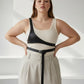 Plus size black body harness by HarnessClub; minimalist vegan leather, architectural design, adjustable.