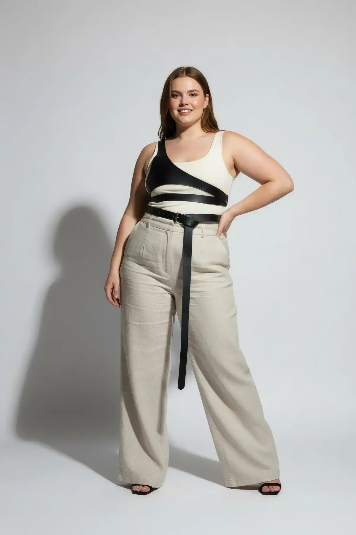 Plus Size Black Body Harness in vegan leather with adjustable minimalist straps worn by model
