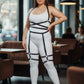 Plus-size garter harness set with black faux-leather straps over a white bodysuit, full silhouette.