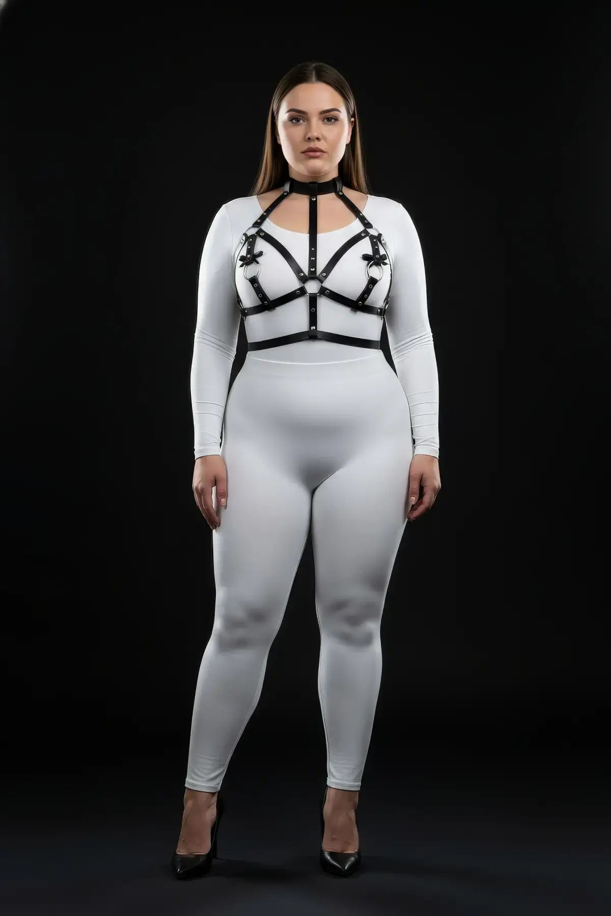 Plus-size black bow-accent chest bralette harness with collar worn over white bodysuit by HarnessClub