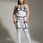 Plus-size white bodysuit with black faux-leather harness and garter straps.