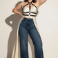 Plus-size black cage chest harness with turtleneck strap over white top; vegan leather body accessory by HarnessClub.