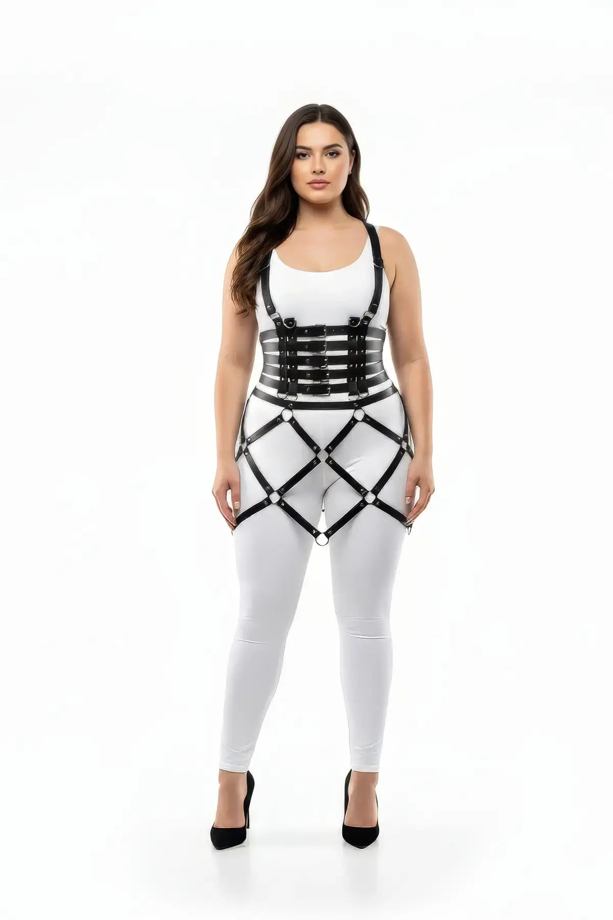 Plus-size black caged ring-detail skirt harness in vegan leather worn over a white bodysuit