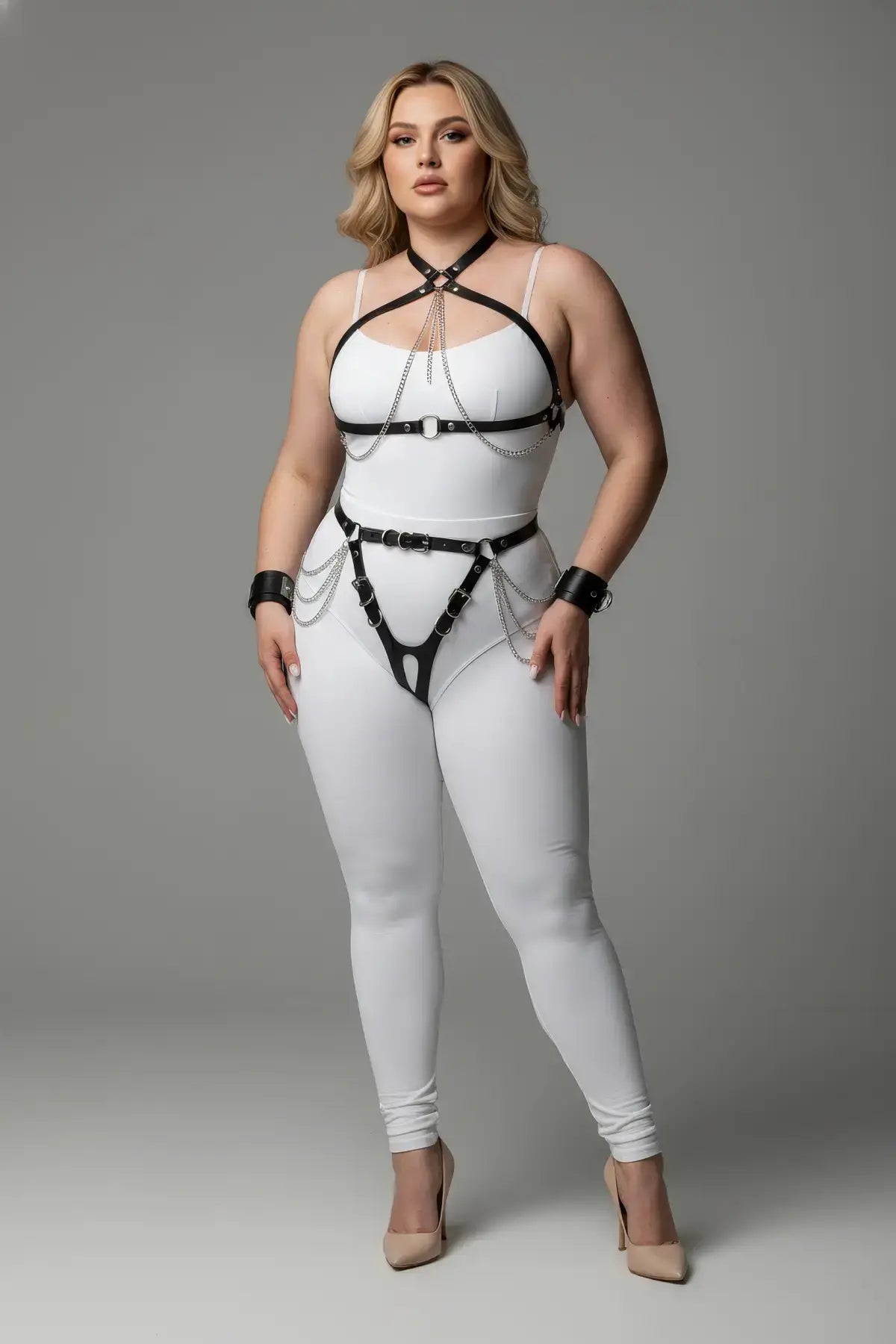 Plus-size black chain and garter harness set by HarnessClub worn over a white bodysuit