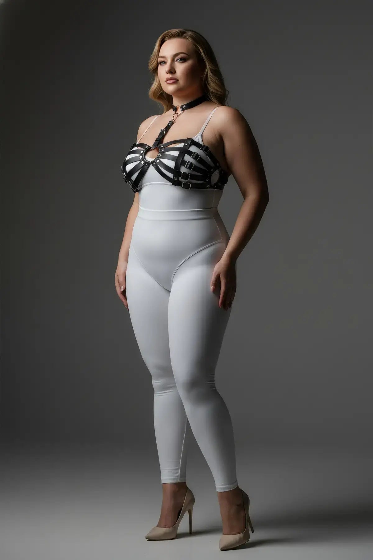 Plus Size Black Chain and O-Ring Faux Leather Chest Harness worn over a white bodysuit