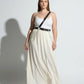 Plus-size black chain-detail body harness belt with silver chains worn over a white tank top and cream skirt