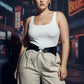Plus-size black chain-detail corset harness in vegan leather worn over a white tank top