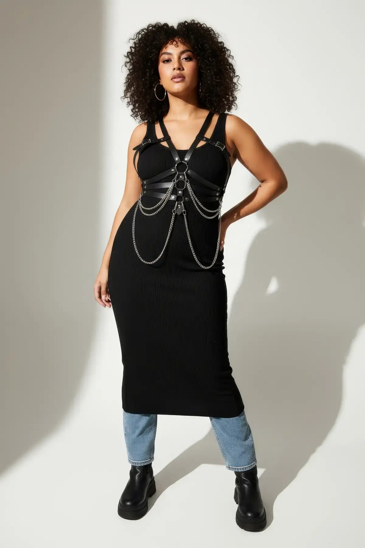 Plus Size Black Chain Detail Corset Harness in vegan leather with silver chains worn over a black dress.