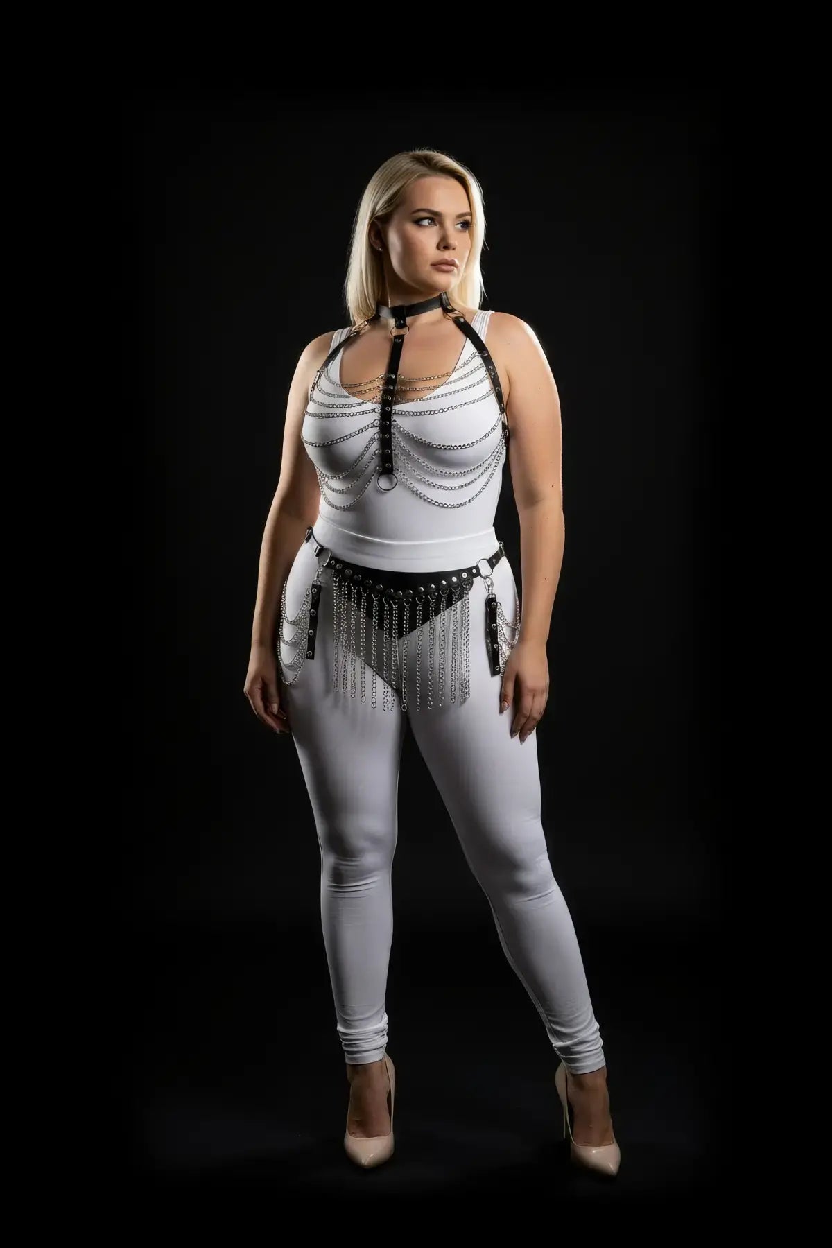 Plus-size black vegan-leather chain-drape and chain-fringe harness set over a white bodysuit; silver chains