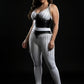 Plus-size black vegan-leather bralette and fringe-skirt two-piece set with silver chain details