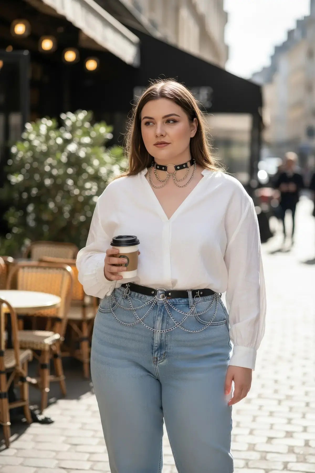 HarnessClub plus-size black choker and chain hip belt two-piece set on a woman outdoors; vegan leather with metal chains.