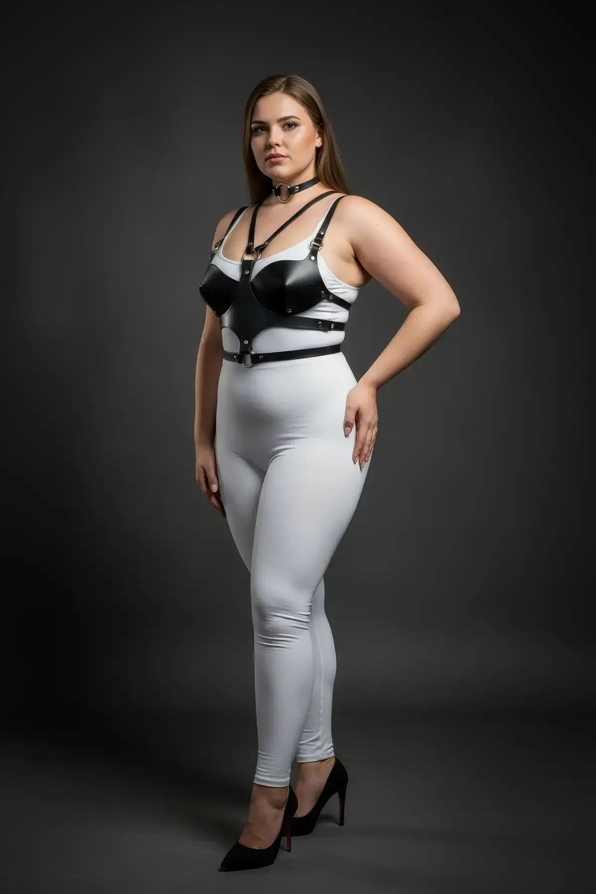 Plus-size black faux-leather choker and chest harness set worn with a white bodysuit