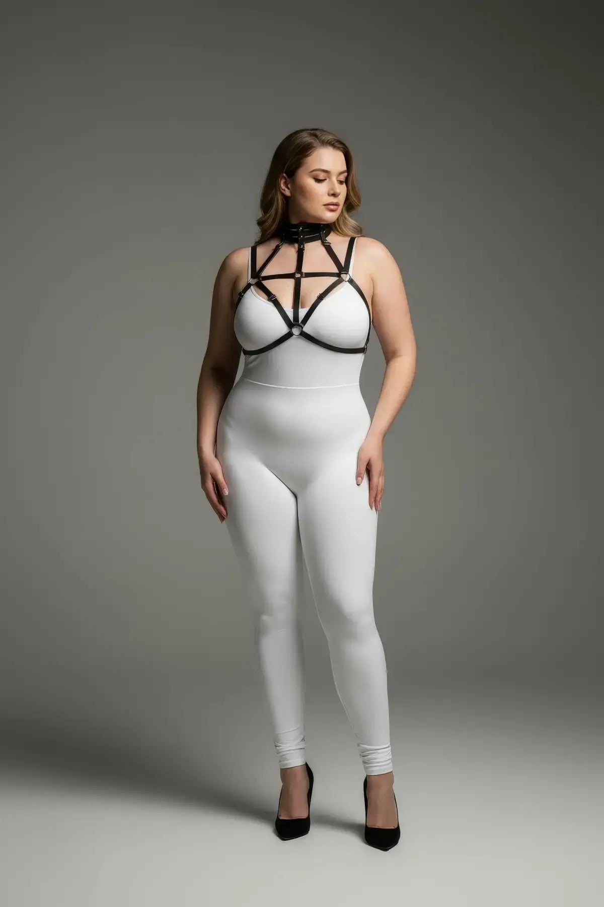 Plus Size Black Choker-Cage Elastic Chest Harness by HarnessClub worn over a white bodysuit