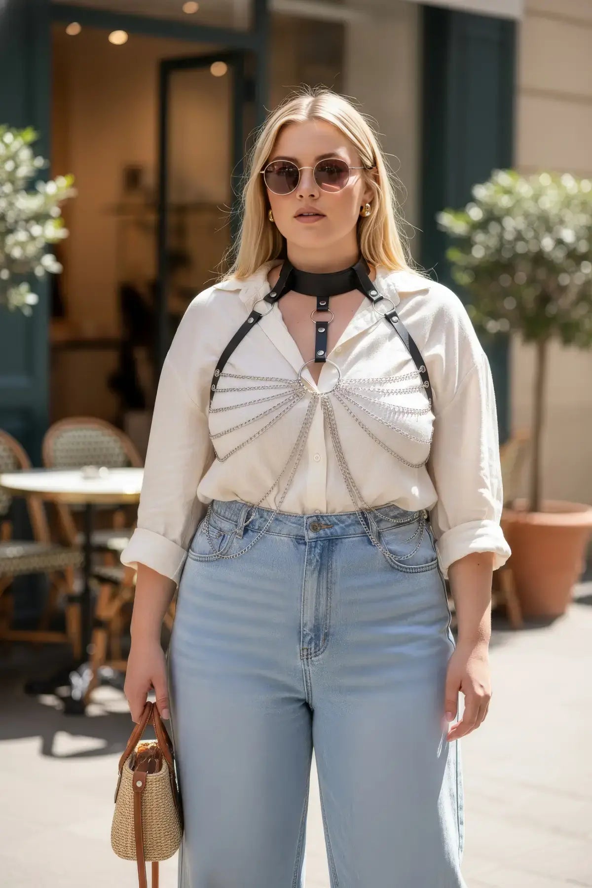 HarnessClub plus-size black vegan leather choker chain bib harness worn over a white shirt