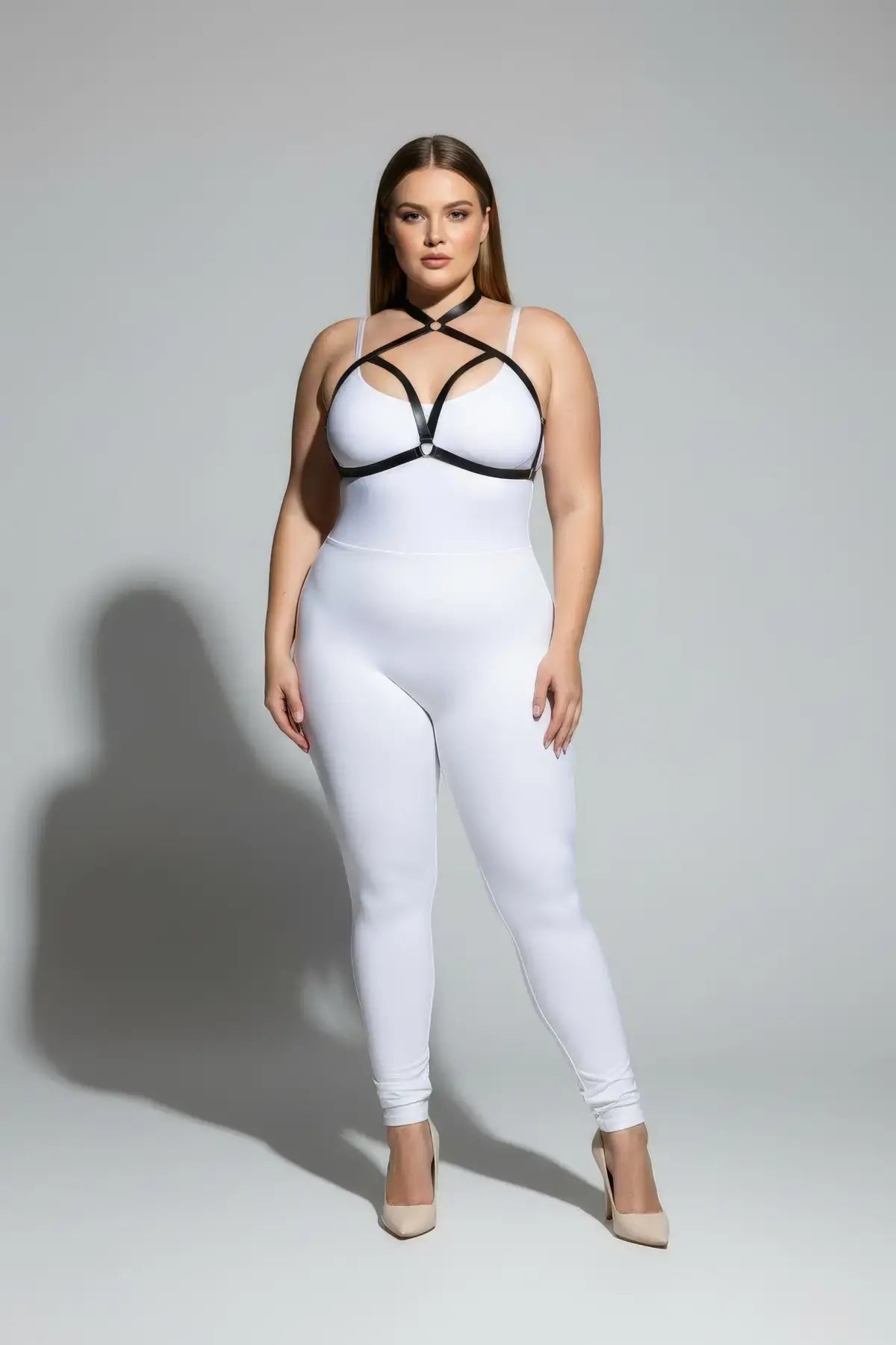 Plus size black cross-strap elastic chest harness with choker worn over white bodysuit.