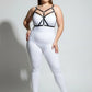 Plus-size black faux-leather cross-strap bustier harness over white top