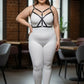 Plus-size black faux-leather cross-strap bustier harness worn over a white bodysuit by HarnessClub