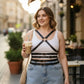 Plus Size Black Cross-Strap Leather Body Harness worn over a white tank top.