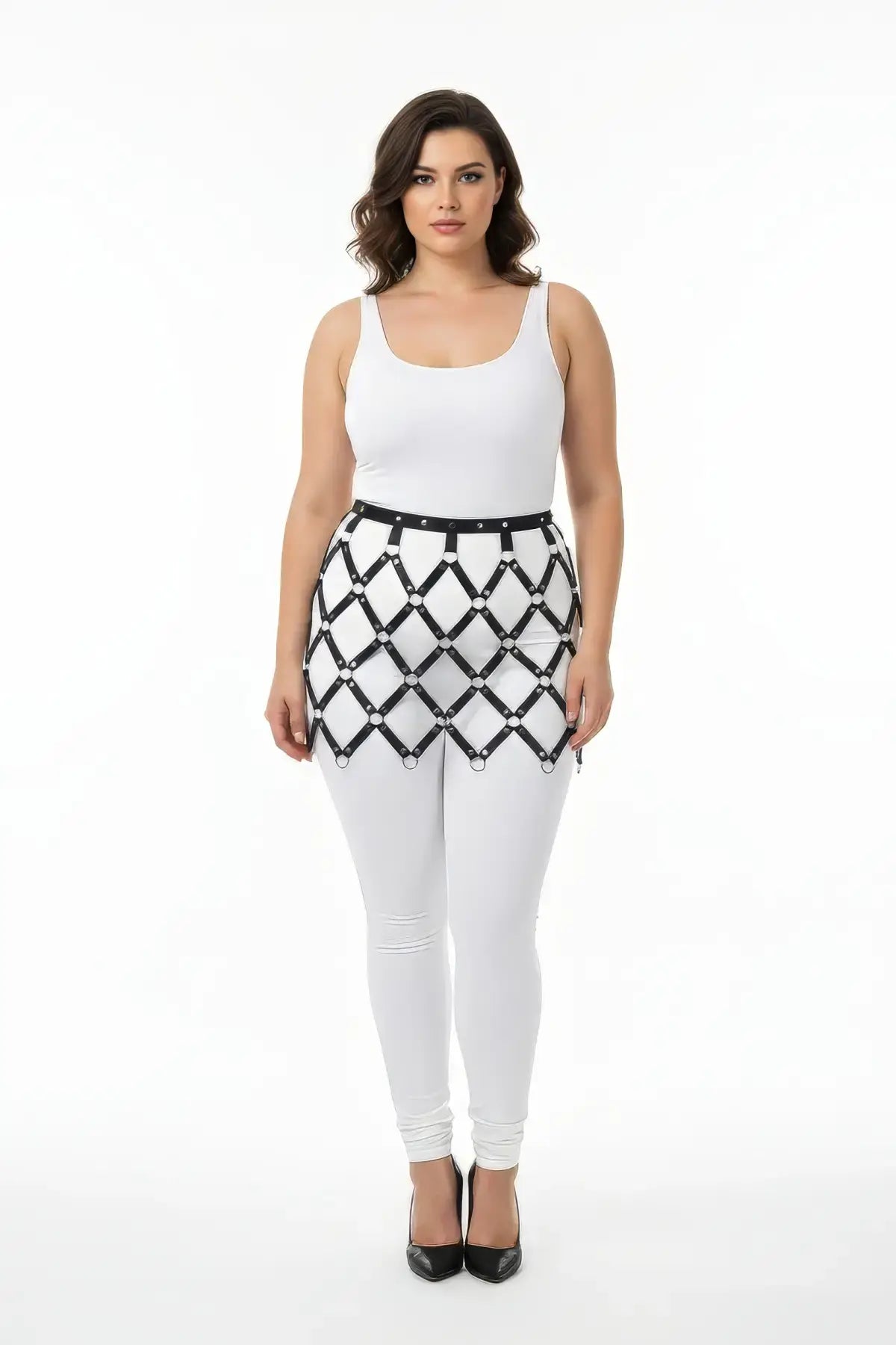 Plus-size black diamond-mesh cage harness skirt in vegan leather worn at the waist.
