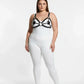 Plus-size black disc O-ring vegan leather chest harness worn over a white bodysuit.