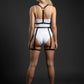 Plus-size black double-band torso harness with thigh straps in vegan leather over a white bodysuit
