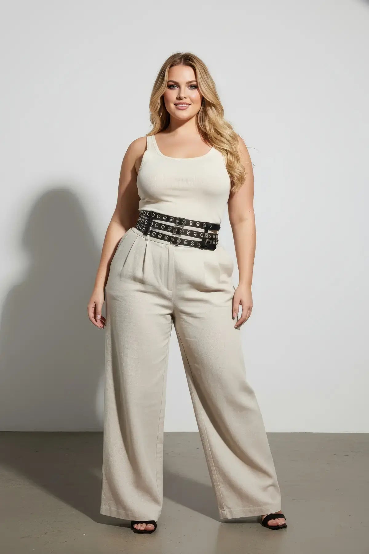 Plus-size HarnessClub black vegan-leather belt with double-row grommets and multiple buckles