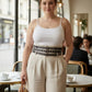 Plus-size black double-row grommet belt with multiple buckles, vegan leather
