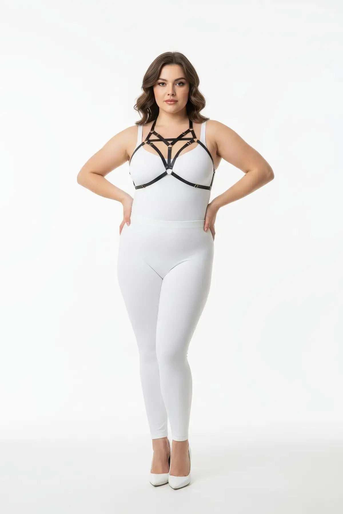 Plus-size black elastic bralette harness with V-frame O-ring on a model wearing a white bodysuit