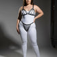 Plus Size Black Elastic Multi-Strap Fantasy Harness by HarnessClub worn over a white bodysuit