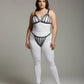 Plus-size black elastic multi-strap fantasy harness by HarnessClub worn over a white bodysuit