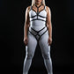Plus size black elastic two-piece harness set over a white bodysuit, chest and hip straps.