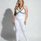 Plus size black faux leather chest harness by HarnessClub worn over a white bodysuit.