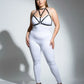 Plus-size black faux leather chest harness by HarnessClub on a model in a white bodysuit.