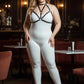 Plus size black faux leather chest harness by HarnessClub worn over a white bodysuit
