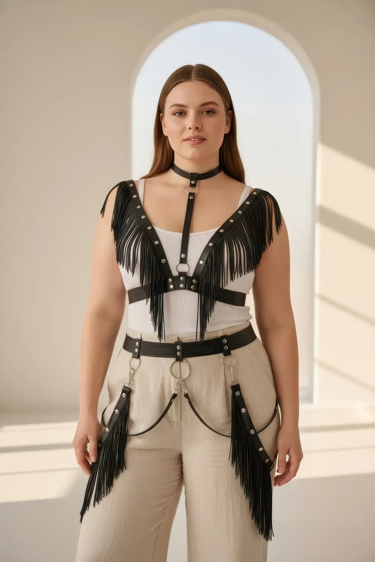 Plus-size black fringe vegan leather body harness with two-tier fringe and studded choker with chains