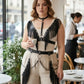 Plus-size black vegan leather fringe body harness with studded choker and chained waist straps