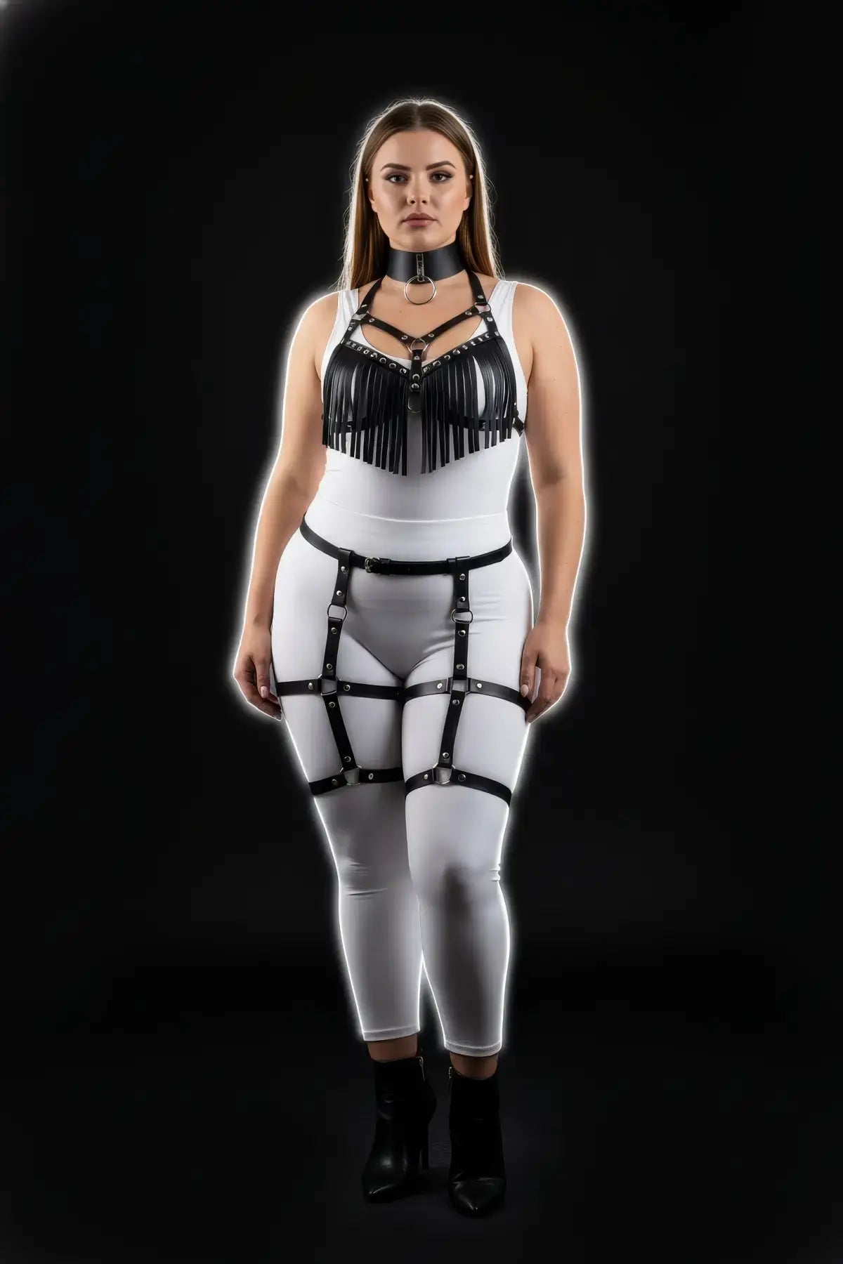 Plus-size black fringe tassel harness and garter set in vegan leather by HarnessClub, worn by model