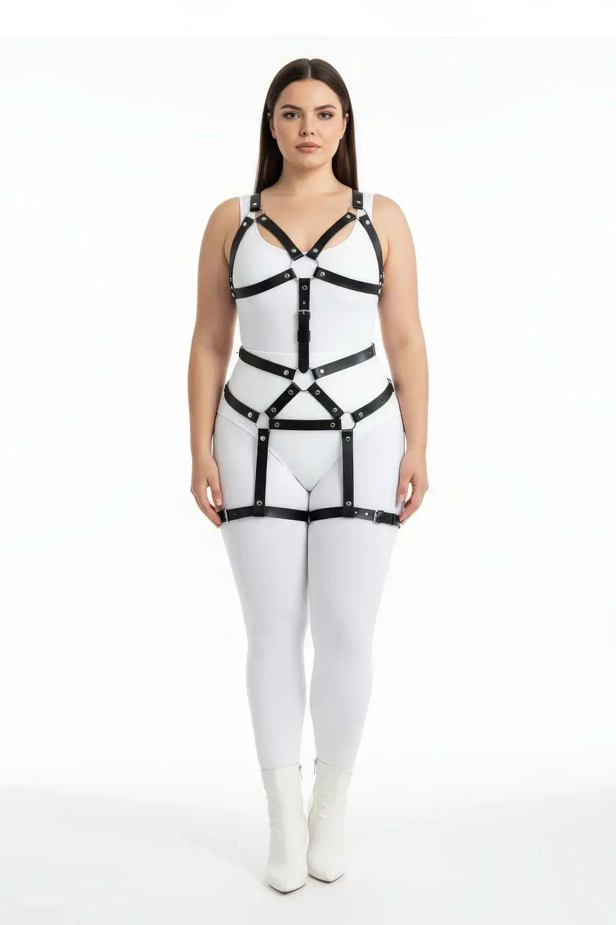 Plus-size black vegan-leather full-body garter harness worn over a white bodysuit