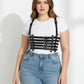 Plus Size Black vegan leather full-torso corset body harness by HarnessClub worn over a white tee and blue jeans