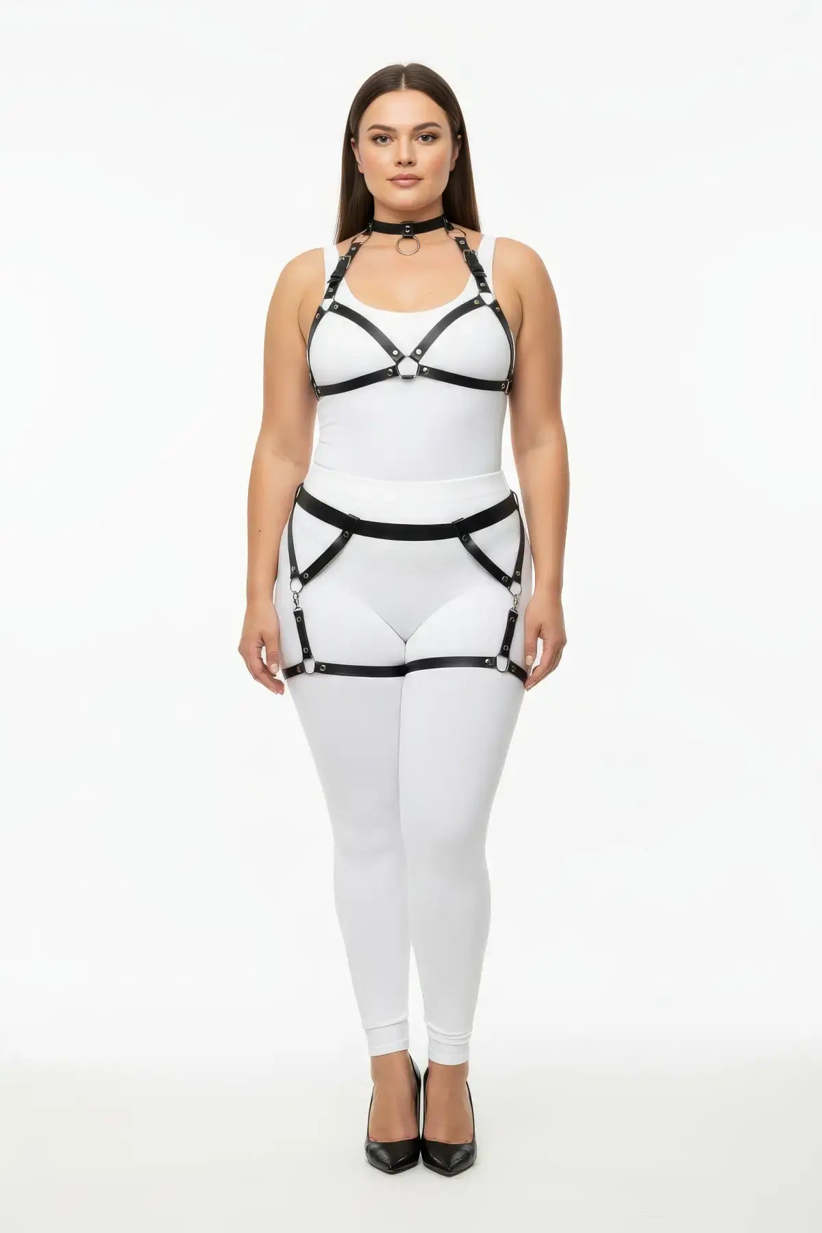 Plus-size black garter-frame full-body harness set by HarnessClub in vegan leather, shown over white bodysuit.