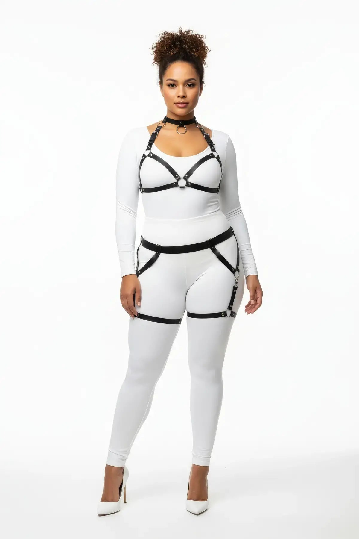Plus size black garter-frame full-body harness set in vegan leather worn by model