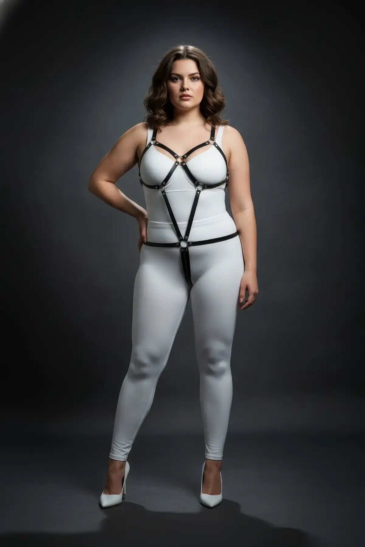 Plus-size black geometric vegan leather full-torso body harness on white bodysuit by HarnessClub on model