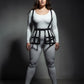 Plus-size black grid cage waist cincher vegan leather body harness worn over white bodysuit